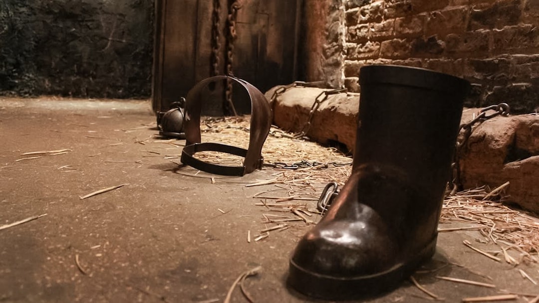 Chains and shackles on the floor of The Clink Prison Museum, London.