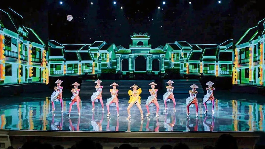 Performers in traditional costumes on stage at Colosseum Cabaret Show, Pattaya.