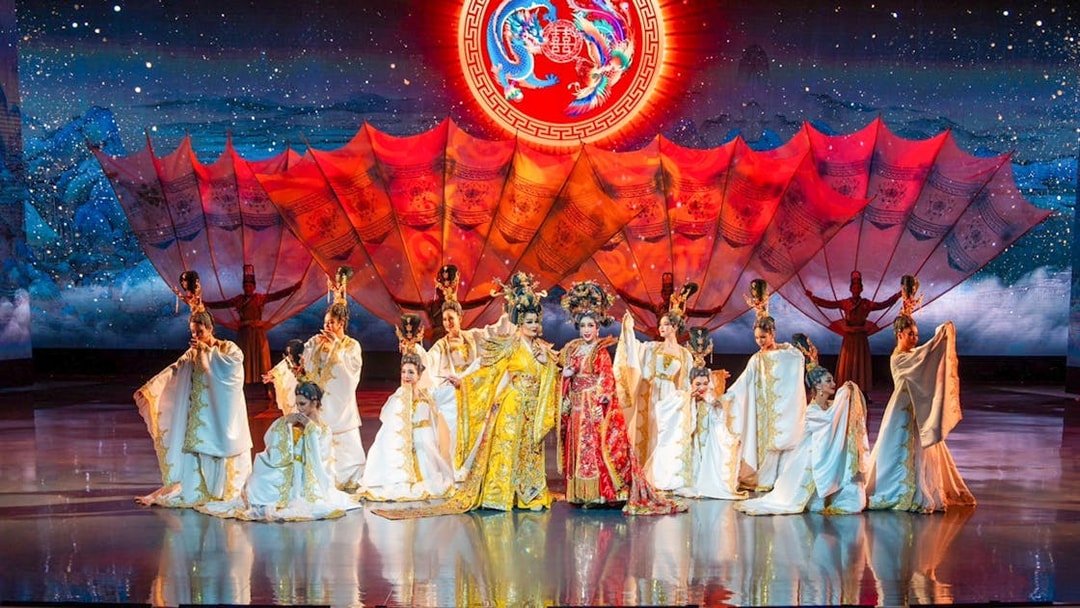 Performers in traditional costumes on stage at Colosseum Cabaret Show, Pattaya.