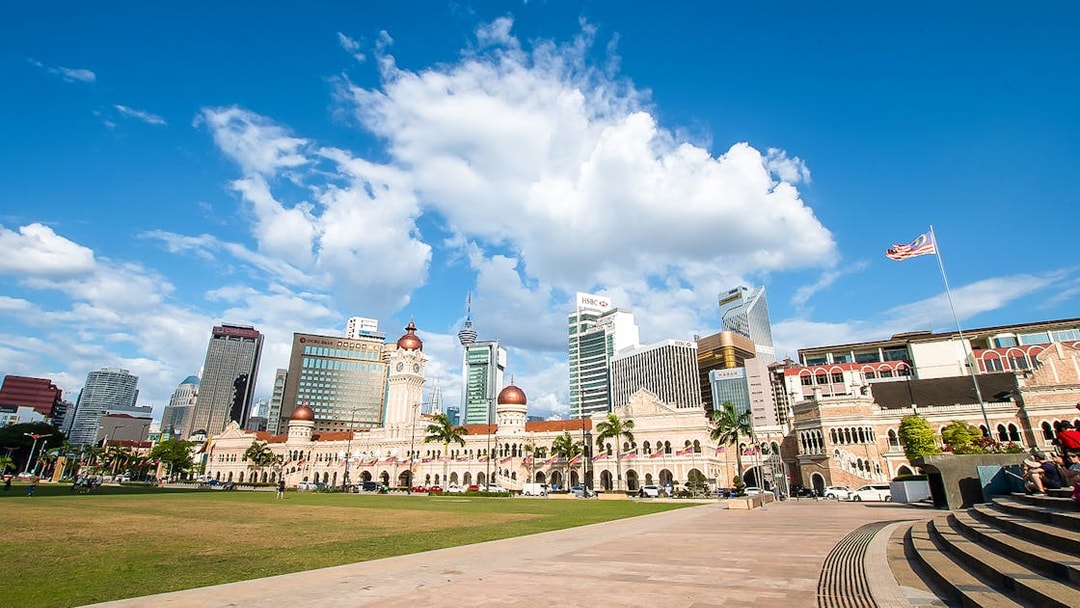 Sultan Abdul Samad Building with Kuala Lumpur skyline in the background.