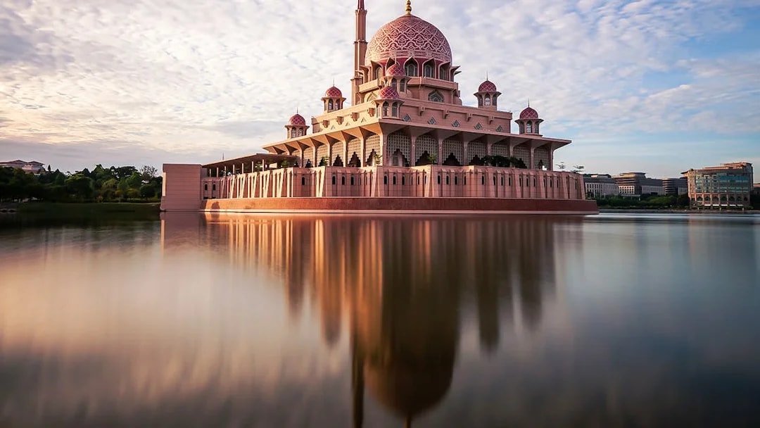 Putra Mosque reflected in the lake, Kuala Lumpur city tour attraction.