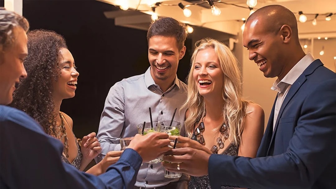 Group of friends toasting drinks at The High Roller, Las Vegas.
