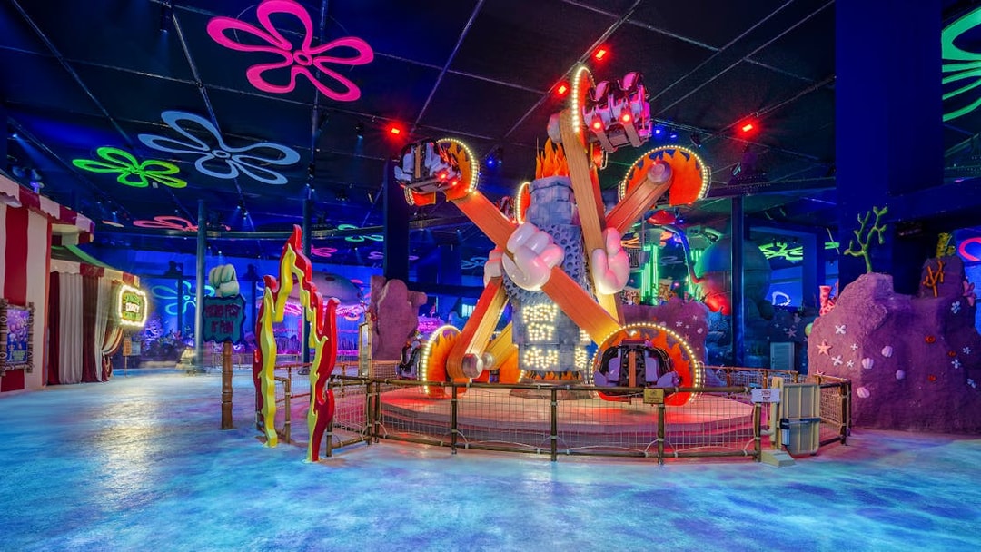 Colorful ride at Nickland in The Land of Legends theme park, featuring vibrant lights and decorations.