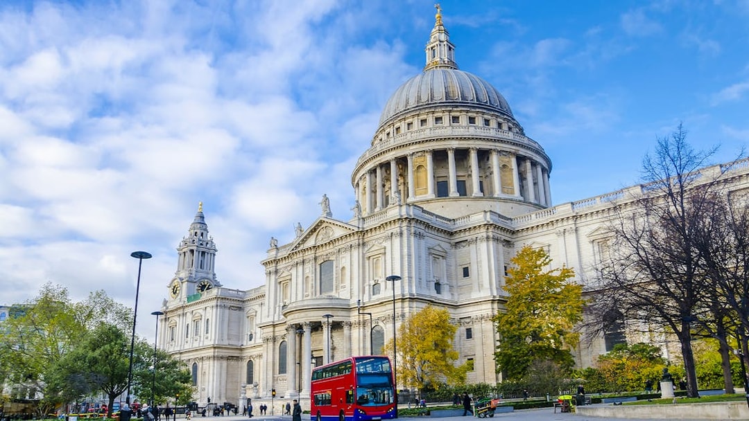 St Paul's Cathedral exterior with red double-decker bus, London.