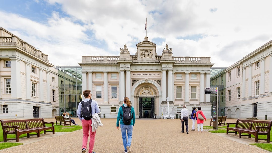 Visitors walking towards the National Maritime Museum entrance in London.