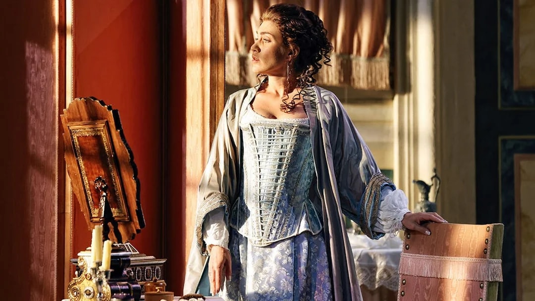 Opera performer in period costume during The Marriage of Figaro scene.