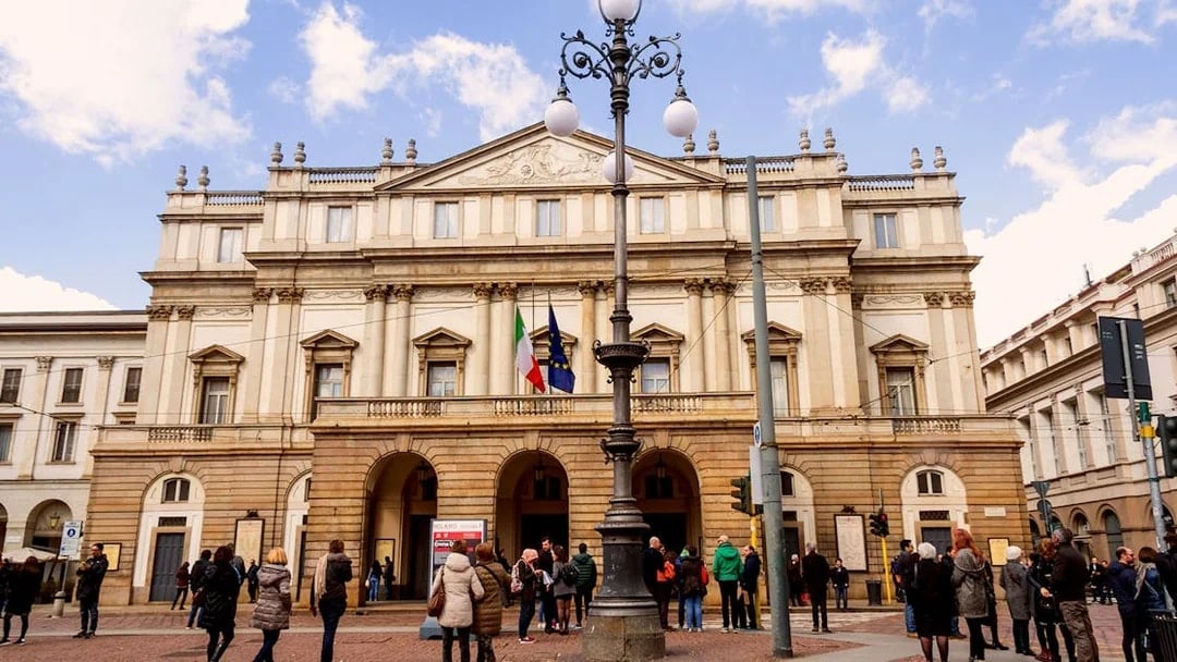 La Scala Opera House in Milan with visitors outside.