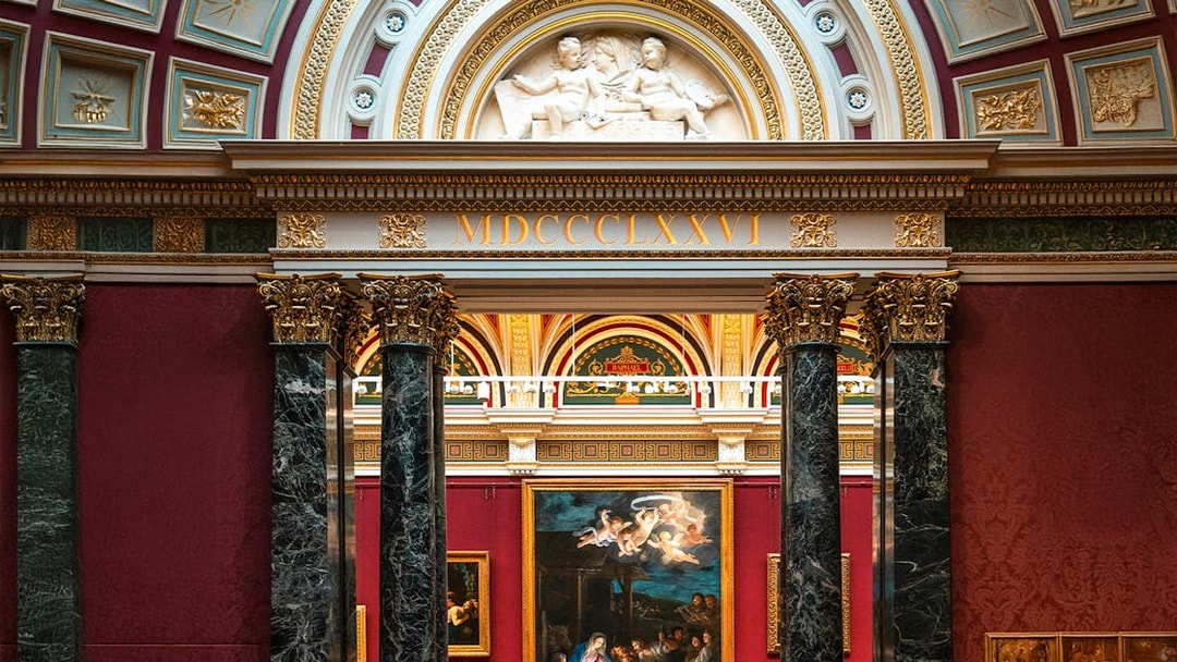 National Gallery London interior with classic European paintings and ornate architecture.