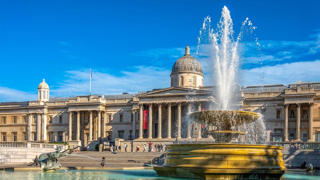 National Gallery exterior with fountain at Trafalgar Square, London.
