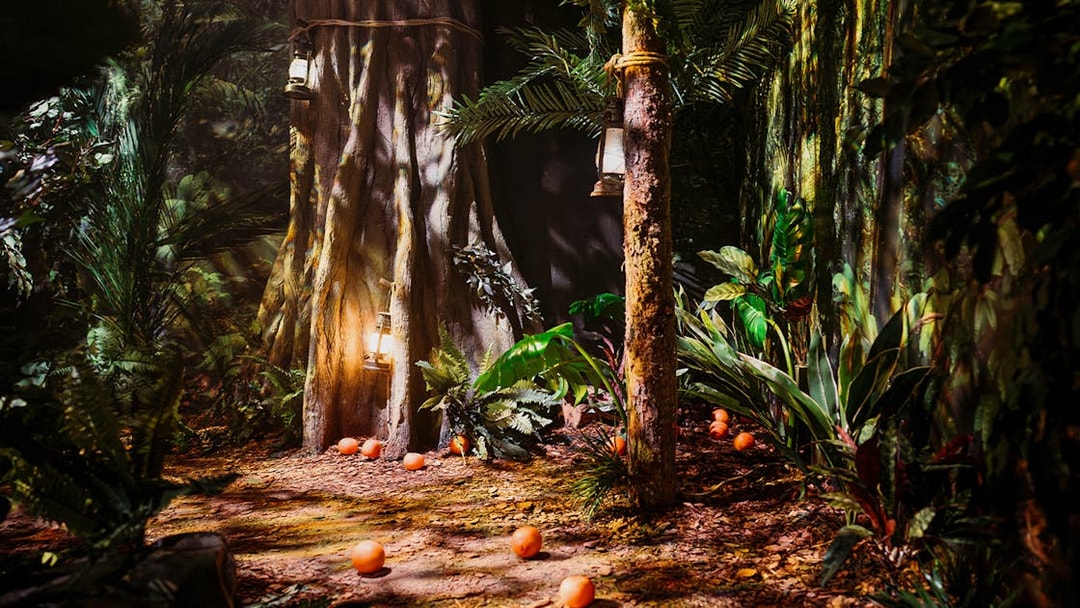 Peru-themed jungle setup with lanterns and oranges at Paddington Bear Experience, London.