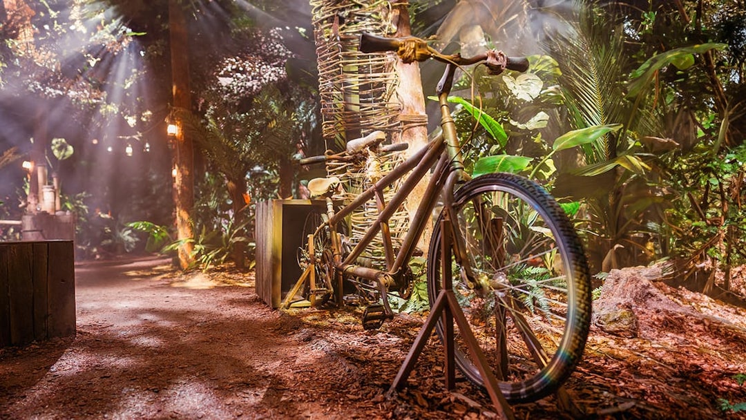 Tandem bicycle in a jungle-themed Peru setup at the Paddington Experience.