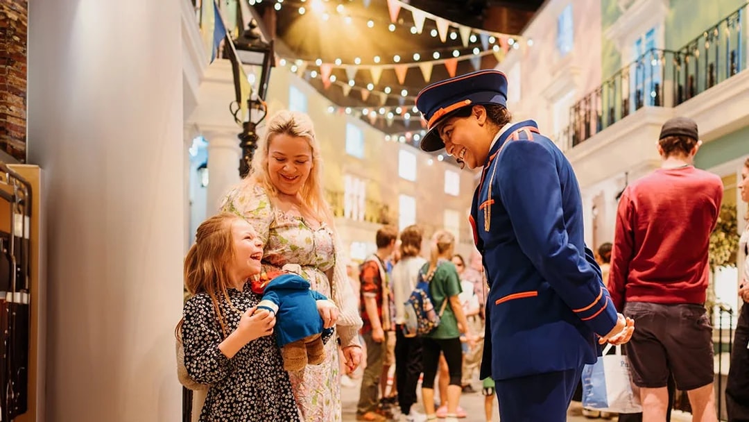 Guests interacting with a Paddington character at the Paddington Experience.