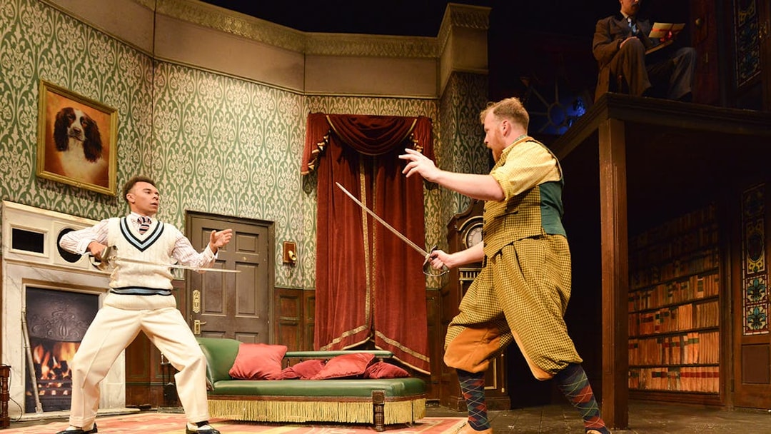 Actors in a comedic sword fight on stage during "The Play That Goes Wrong.