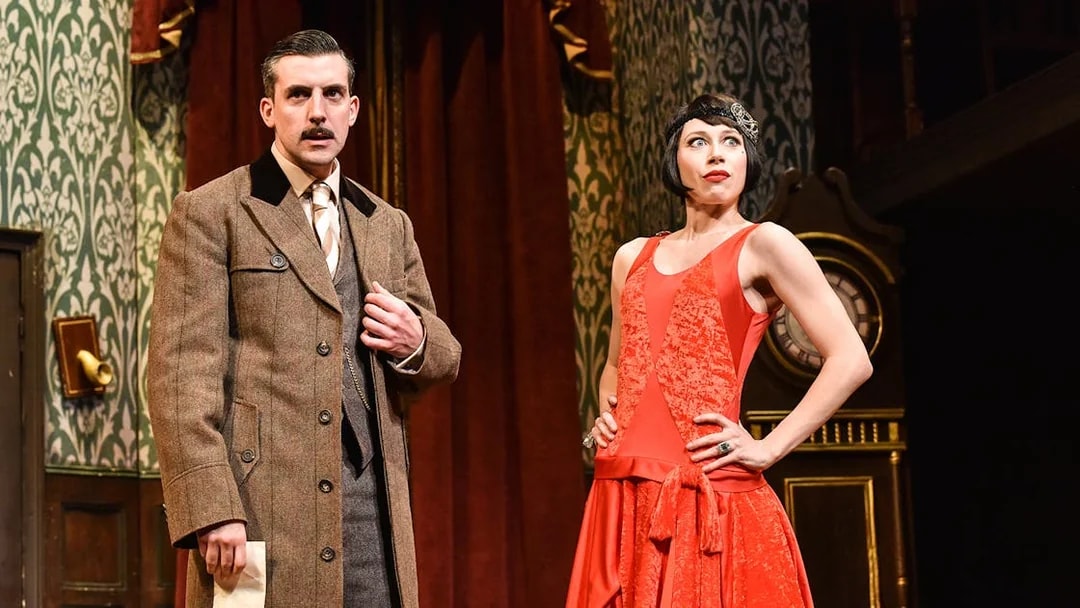 Actors in period costumes on stage during "The Play That Goes Wrong.