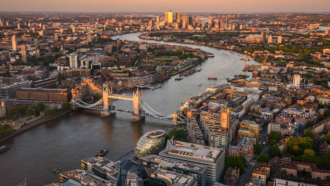 London skyline with Tower Bridge and Thames River at sunset from The Shard.