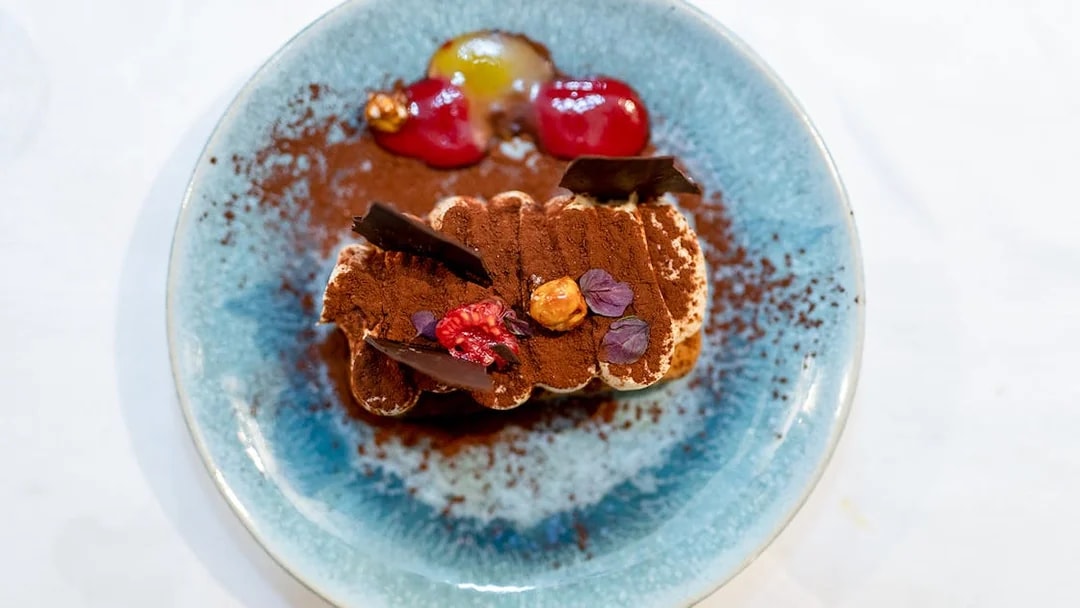 Tiramisu dessert served on Le Diamant Bleu dinner cruise in Paris.