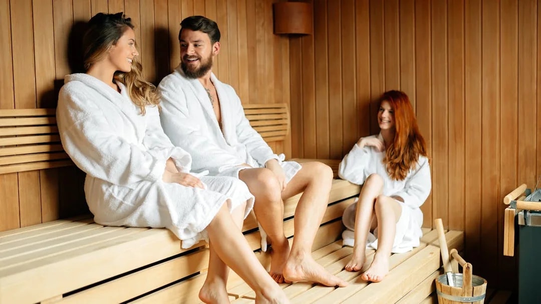 People relaxing in a sauna at Therme Bucuresti.
