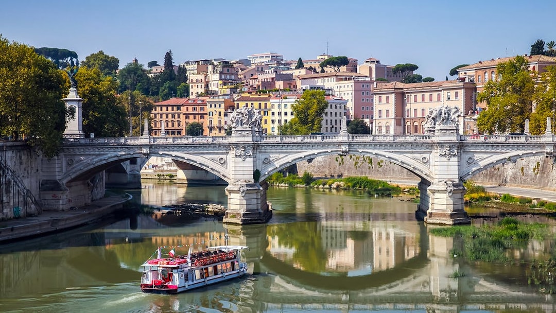 Touristic boat on the Tiber River near Ponte Vittorio Emanuele II, Rome.