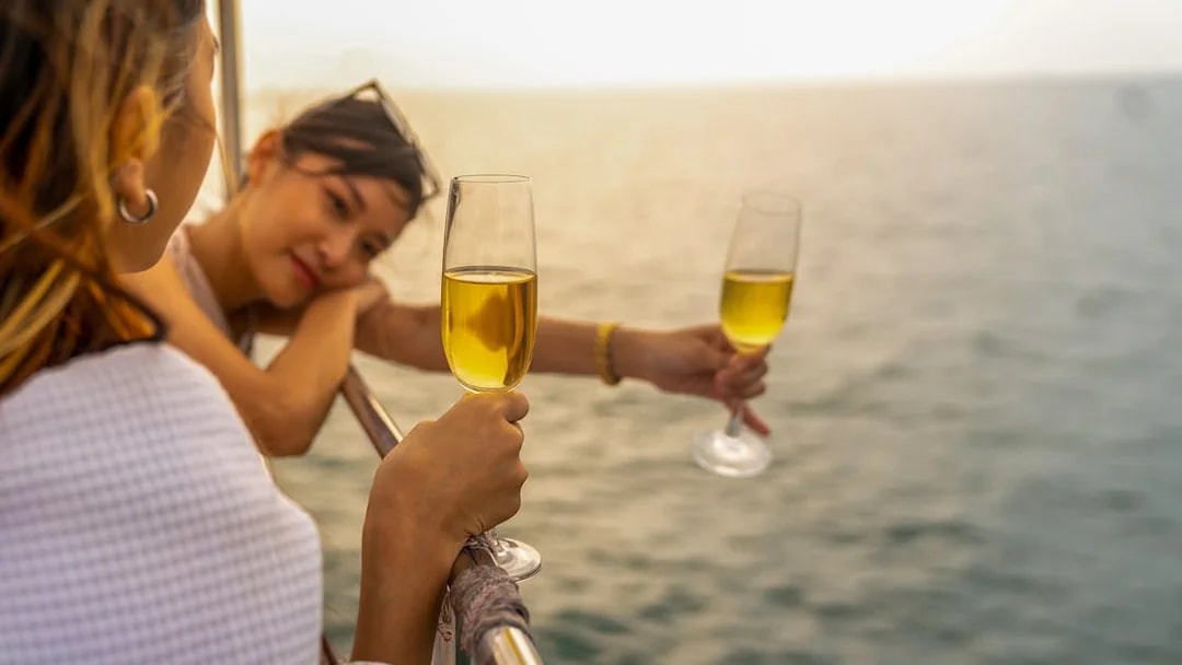 Guests enjoying drinks on a Tiber River cruise in Rome.