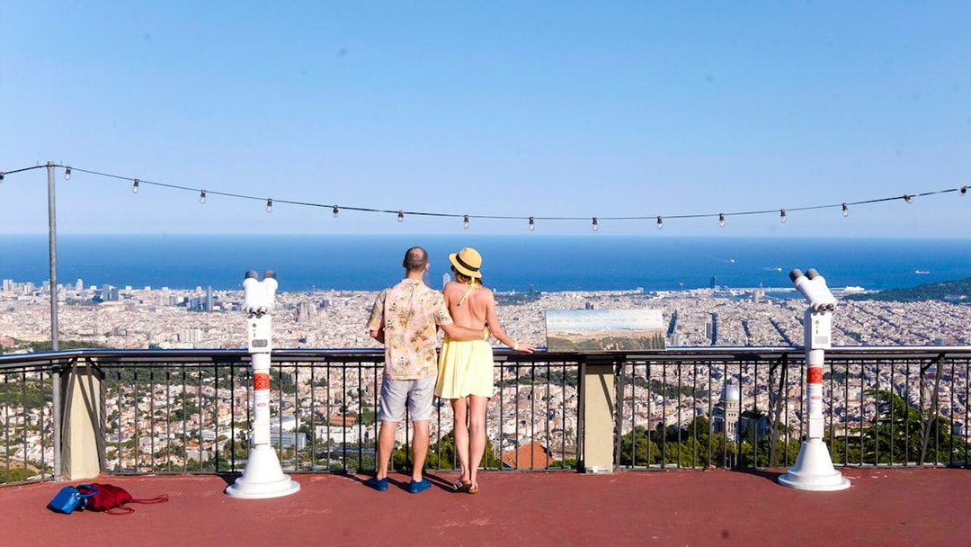 Visitors enjoying the view of Barcelona from Tibidabo Amusement Park.