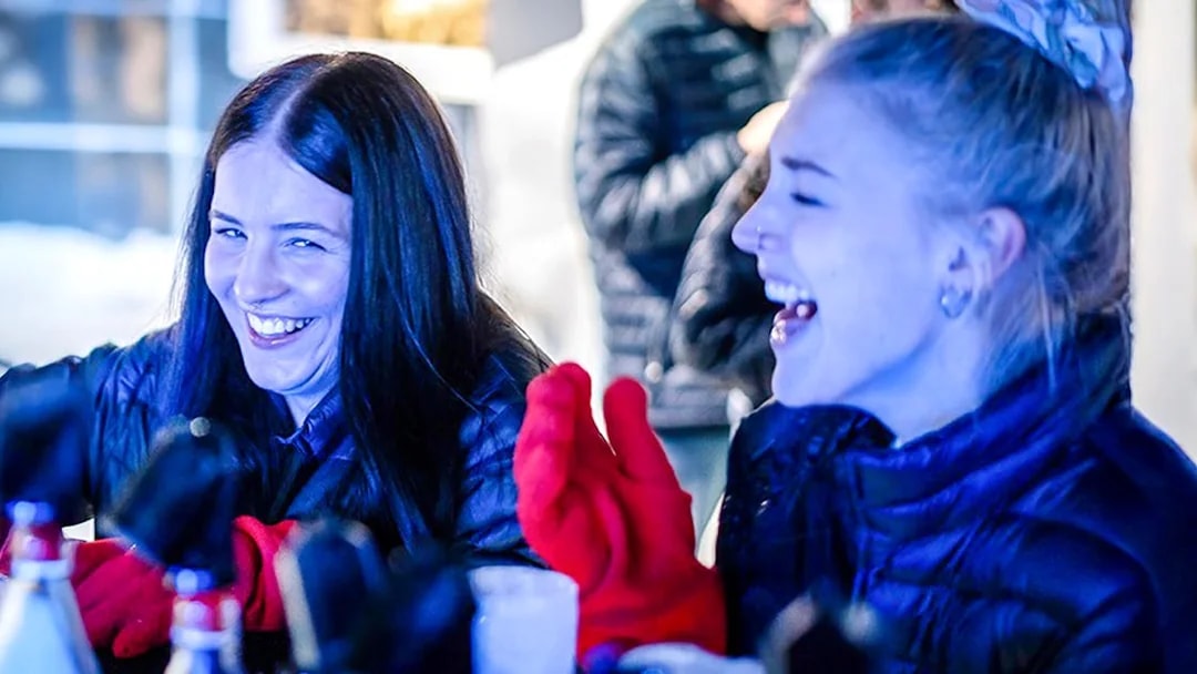 Guests laughing and enjoying drinks at the Berlin Icebar.