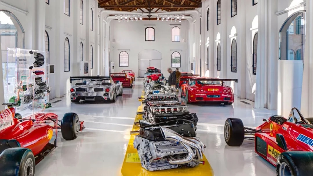 Ferrari engines and race cars displayed at Museo Enzo Ferrari Modena.