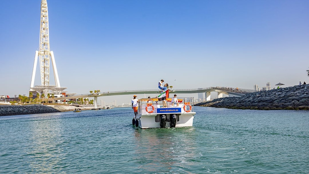 Boat on Dubai waterway near Ain Dubai during Atlantis Scenic Cruise.