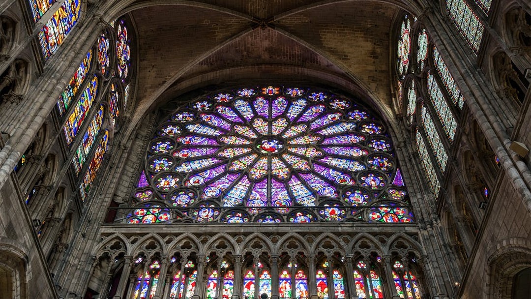 Stained glass rose window inside Basilica of Saint-Denis, Paris.