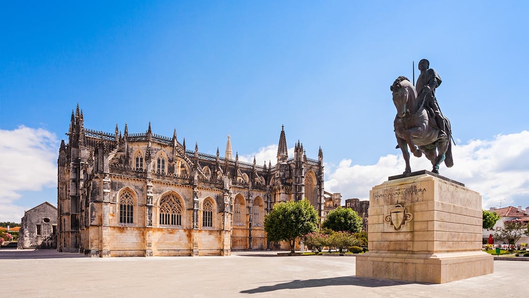 Batalha Monastery with equestrian statue in foreground, Batalha, Portugal.
