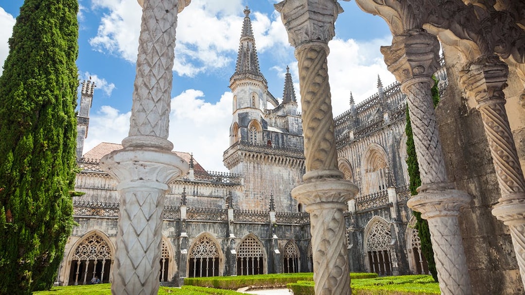 Batalha Monastery's ornate Gothic architecture with detailed arches and spires in Portugal.