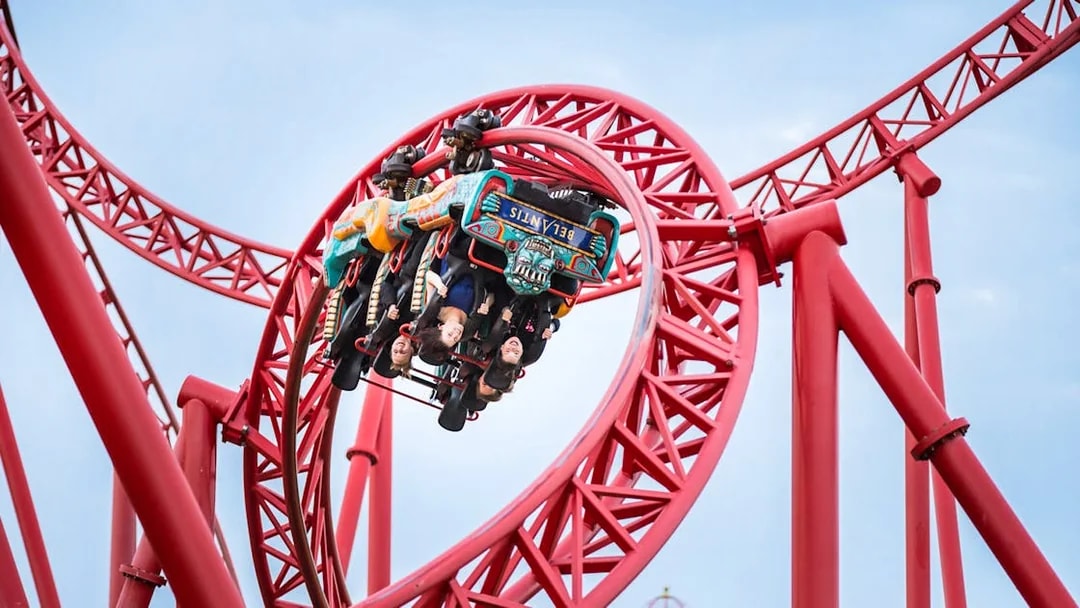 Roller coaster loop with riders at Belantis Adventure Park.
