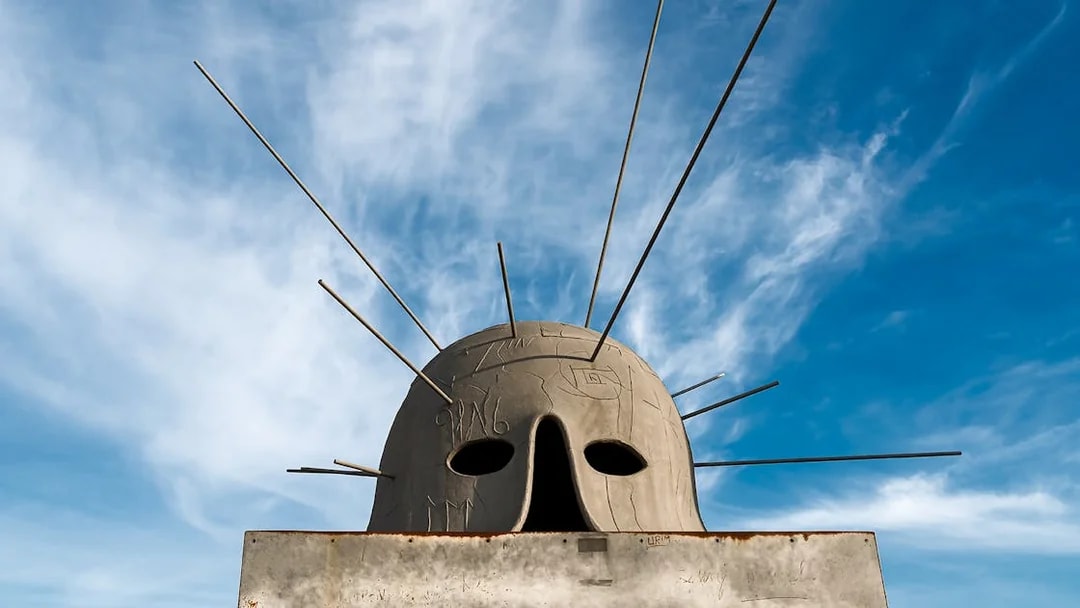 Sculpture with rods at Castel Sant'Elmo exhibit against blue sky.