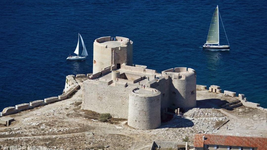 Château d’If fortress with sailboats in the Mediterranean Sea, Marseille, France.