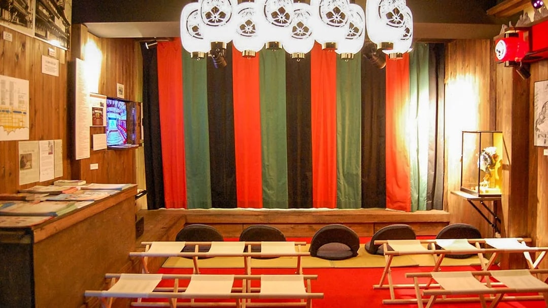 Seating area inside Osaka Dotonbori Museum Namikiza with traditional decor.