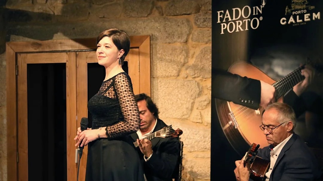 Fado concert in Porto wine cellar with musicians performing.