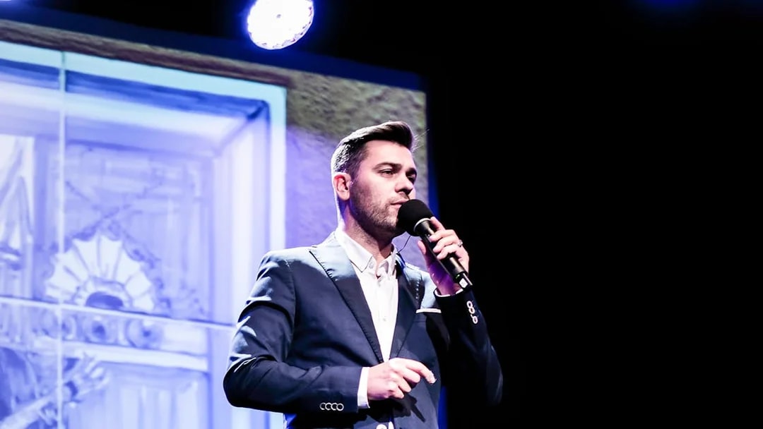 Performer singing at Fado in Chiado show, Lisbon.