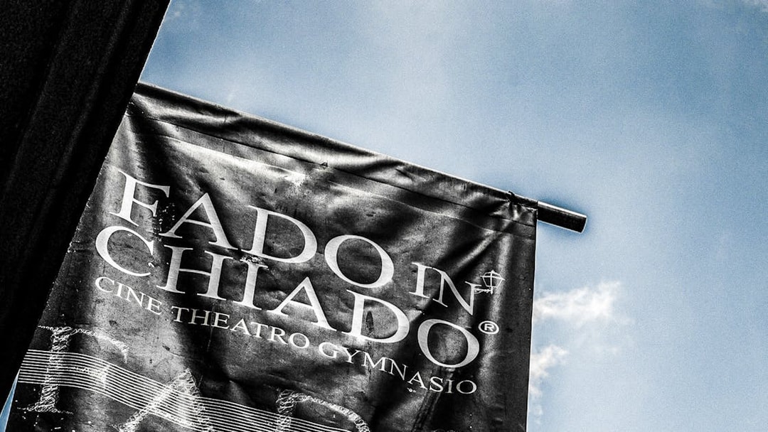 Banner for Fado in Chiado at Cine Theatro Gymnasio against blue sky
