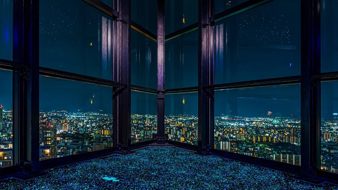 View of Fukuoka cityscape at night from Fukuoka Tower observation deck.