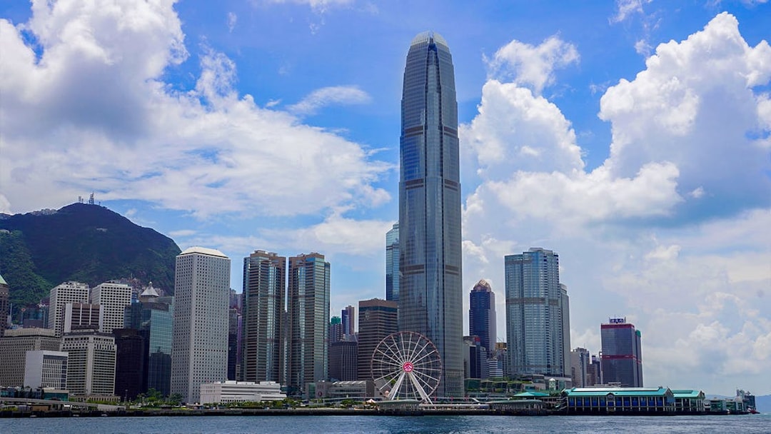Hong Kong skyline with Observation Wheel and skyscrapers.