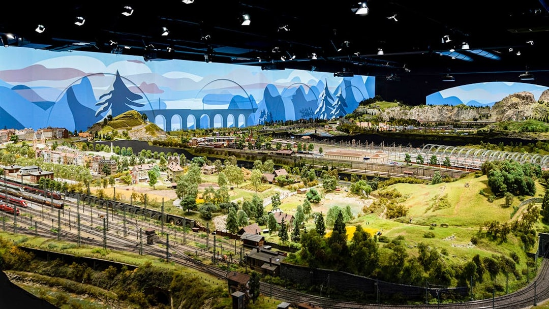 Miniature railway landscape at Hzero, featuring detailed model trains and scenic countryside.