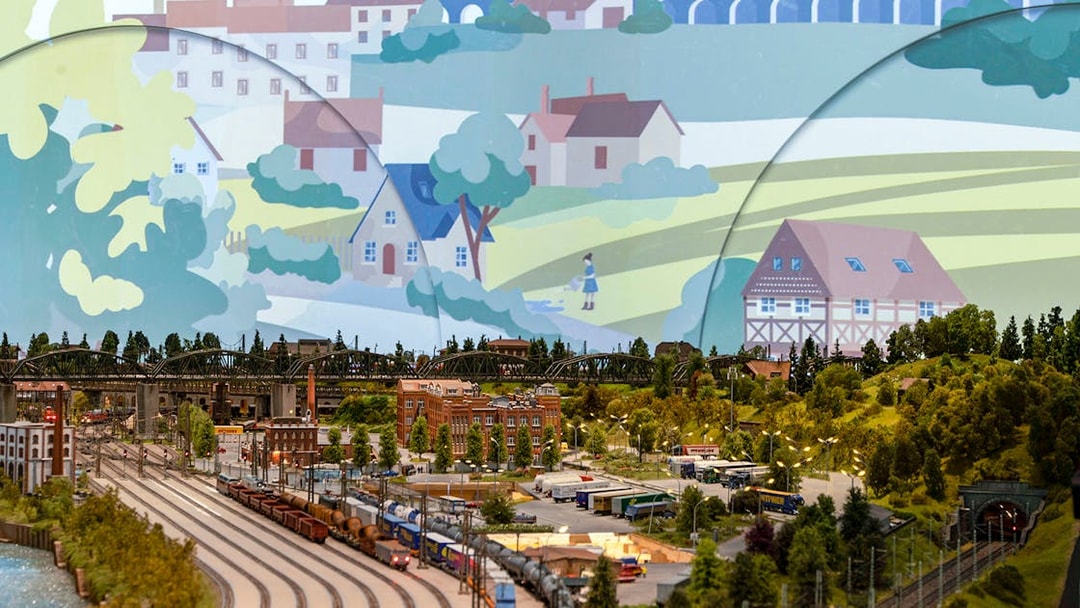 Miniature railway landscape with trains, buildings, and greenery at Hzero: The Miniature Railway Enterprise.
