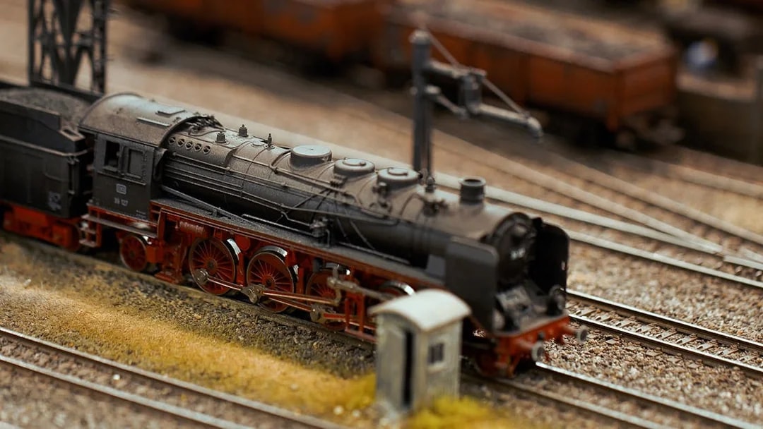 Miniature steam locomotive on tracks at Hzero Miniature Railway Museum.