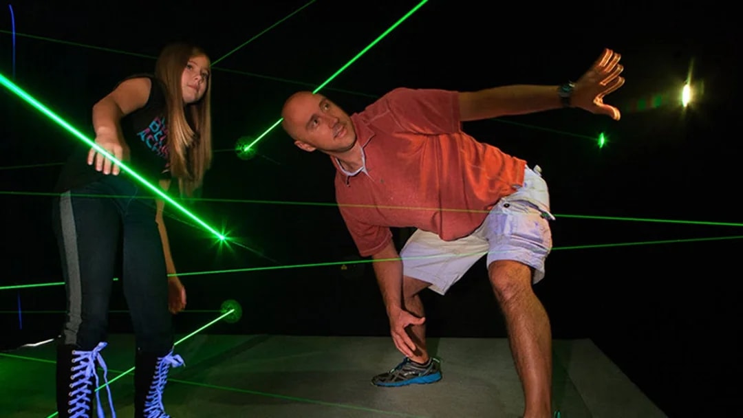 Participants navigating laser maze at Katmandu Park.