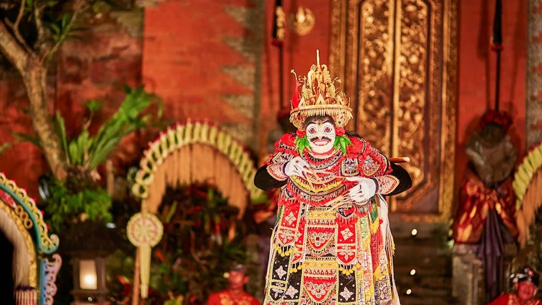 Performer in traditional costume at Legong Dance Show, Ubud Palace, Bali.