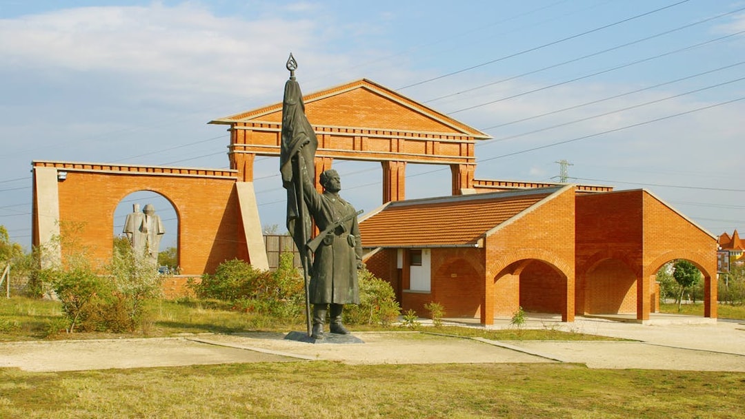 Statue and brick structures at Memento Park, Budapest.