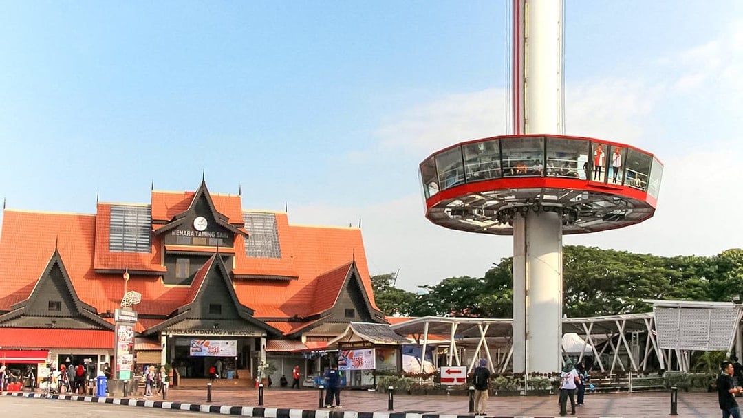 Tourists viewing Melaka from Menara Taming Sari tower.