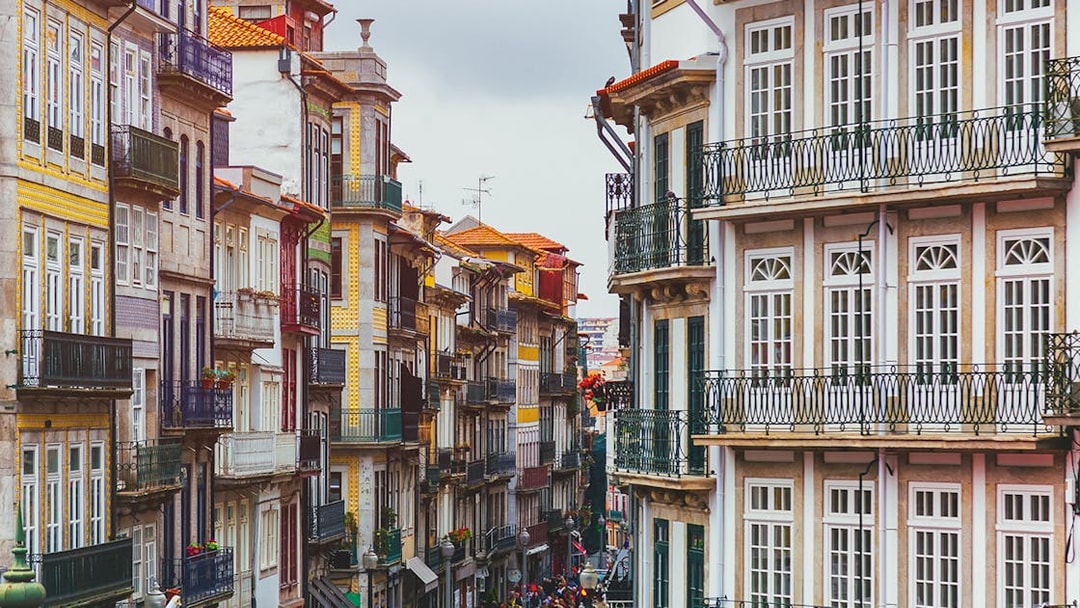 Colorful buildings on a narrow street in Porto near Misericórdia Museum and Church.