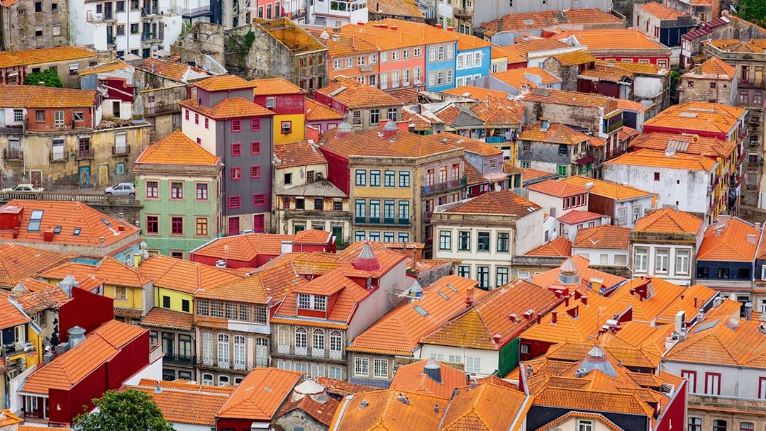 Aerial view of colorful rooftops in Porto near Misericórdia Museum and Church.