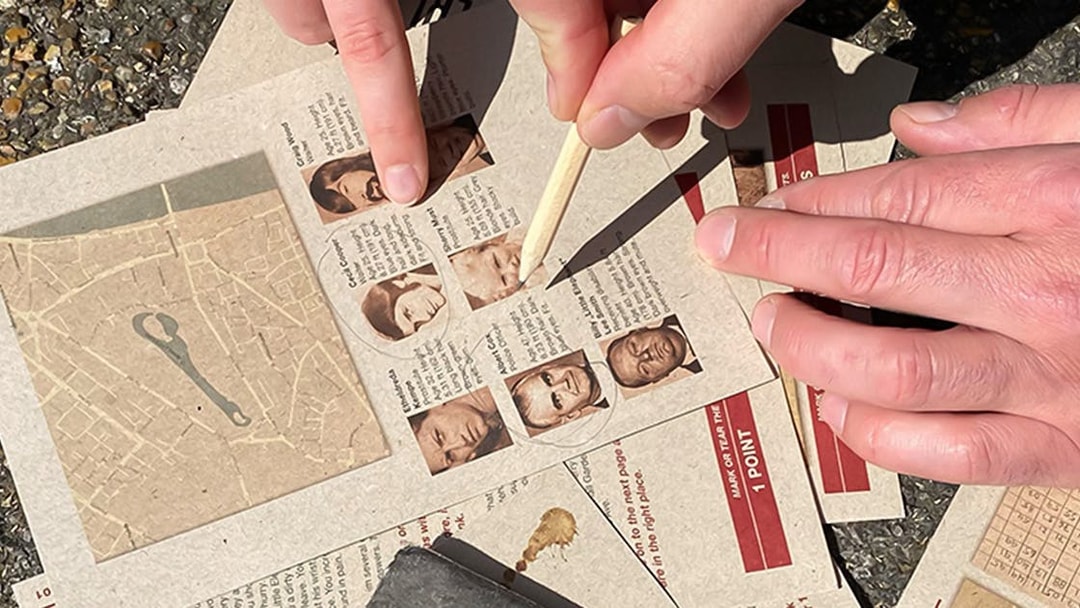 Participants solving clues during Nyhavn Mystery Adventure in Copenhagen.