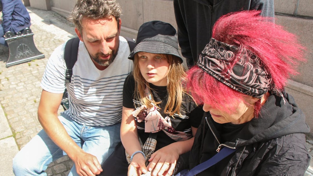 Group solving clues during Nyhavn Mystery Adventure in Copenhagen.